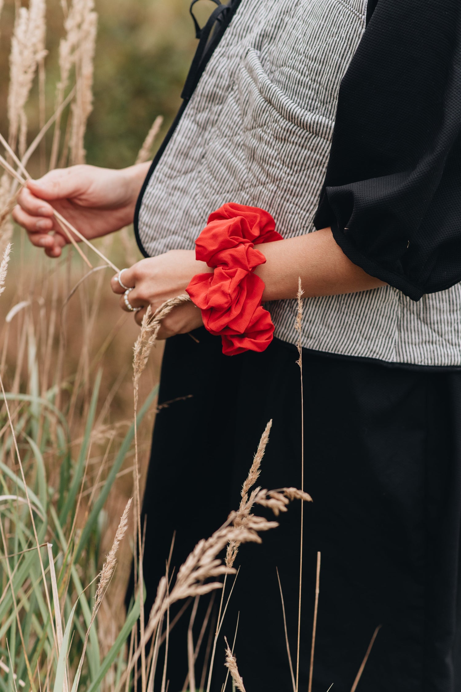 red scrunchie on a wrist